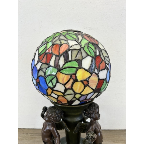 408 - A Widdop Bingham & Co Ltd bronze effect resin figural table lamp with Tiffany style stained glass sh... 