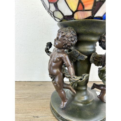 408 - A Widdop Bingham & Co Ltd bronze effect resin figural table lamp with Tiffany style stained glass sh... 