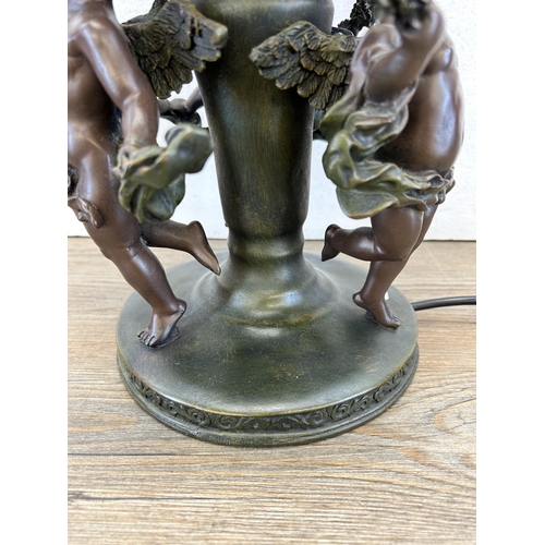 408 - A Widdop Bingham & Co Ltd bronze effect resin figural table lamp with Tiffany style stained glass sh... 