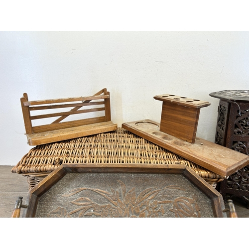 420 - Five items, two wooden pipe racks, one wicker basket, one early 20th century carved mahogany twin ha... 