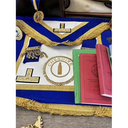 422 - A collection of Masonic regalia to include tankard, sash, Cheshire medallion etc.