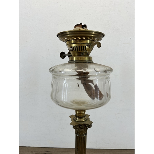 423 - An Eltex brass Corinthian column and clear glass oil lamp - approx. 51cm high