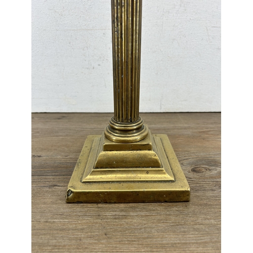 423 - An Eltex brass Corinthian column and clear glass oil lamp - approx. 51cm high