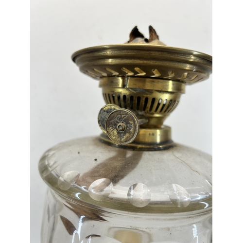 423 - An Eltex brass Corinthian column and clear glass oil lamp - approx. 51cm high