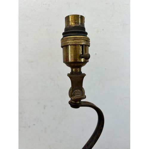 425 - A late 19th/early 20th century W. A. S. Benson wrought iron and brass desk lamp - approx. 34cm high