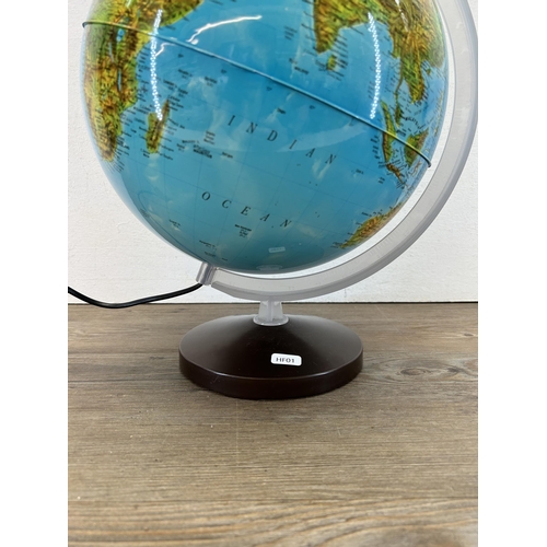 426 - An illuminating terrestrial globe - approx. 40cm high