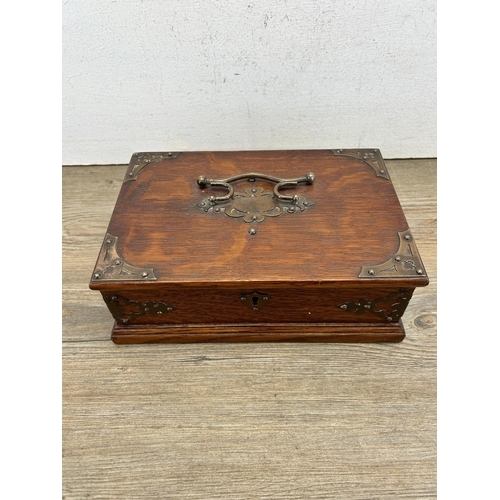 433 - An early 20th century oak and copper cigar box - approx. 9cm high x 24cm wide x 16cm deep