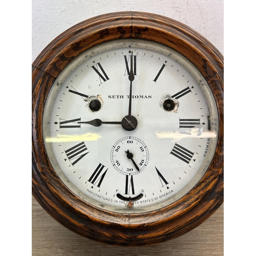 438 - A late 19th/early 20th century Seth Thomas oak cased nautical circular wall clock with white enamel ... 