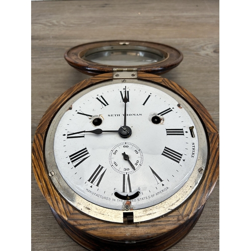 438 - A late 19th/early 20th century Seth Thomas oak cased nautical circular wall clock with white enamel ... 