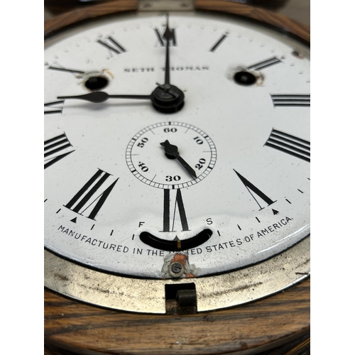 438 - A late 19th/early 20th century Seth Thomas oak cased nautical circular wall clock with white enamel ... 