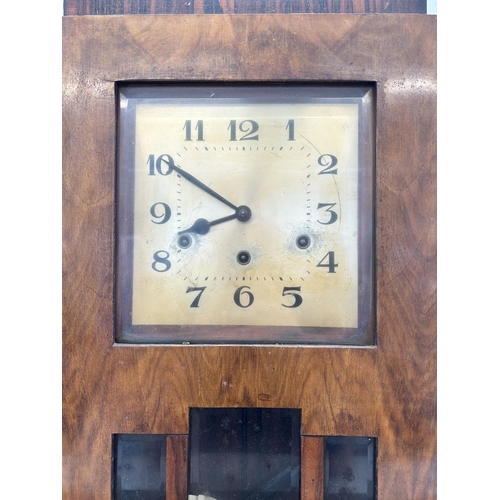 439 - A mid 20th century walnut cased chiming wall clock with pendulum and key - approx. 65cm high x 32cm ... 