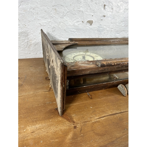 442 - A Victorian walnut cased wall clock with pendulum