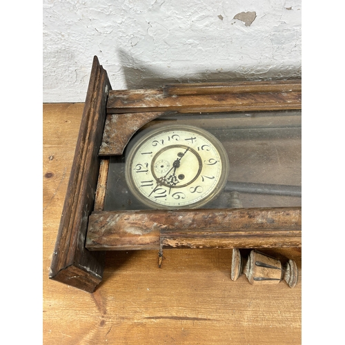 442 - A Victorian walnut cased wall clock with pendulum