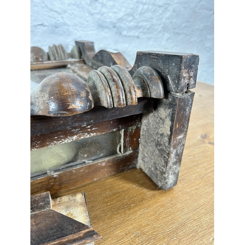 442 - A Victorian walnut cased wall clock with pendulum