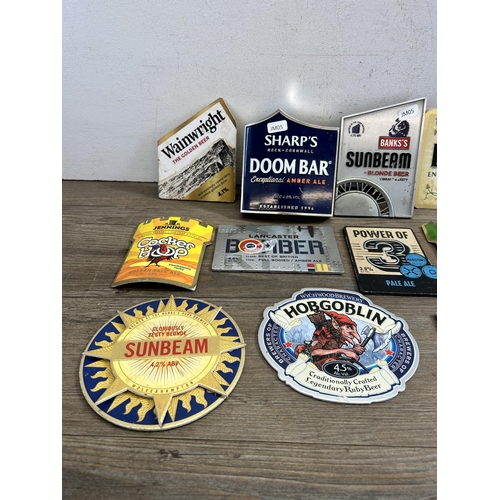 445 - A collection of brewery advertising pump badges