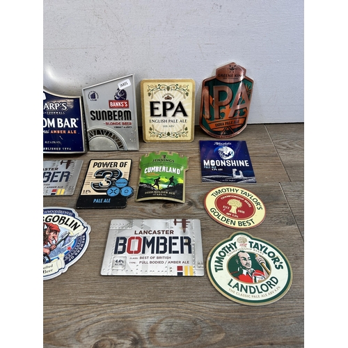 445 - A collection of brewery advertising pump badges