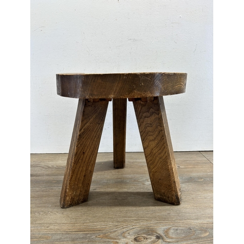 448 - A 19th century style elm milking stool - approx. 33cm high