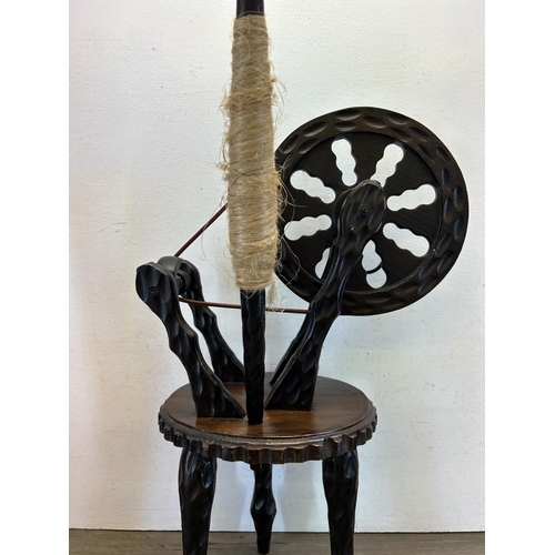 453 - A Spanish carved hardwood spinning wheel - approx. 72cm high