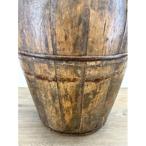 454 - A 19th century primitive oak and iron banded bucket - approx. 65cm high