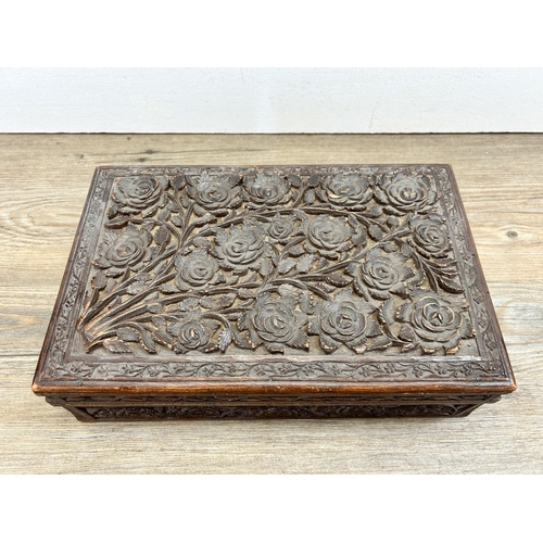 467 - A mid 20th century Indian carved teak box - approx. 9cm high x 28cm wide x 18cm deep