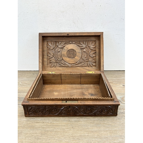 467 - A mid 20th century Indian carved teak box - approx. 9cm high x 28cm wide x 18cm deep