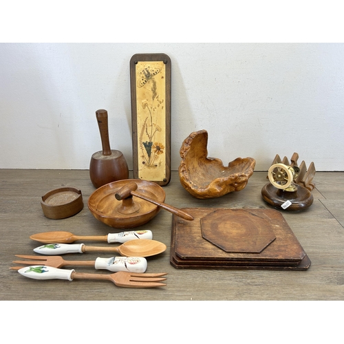 470 - A collection of treenware to include mid 20th century beech and brass ship's wheel nutcracker, teak ... 