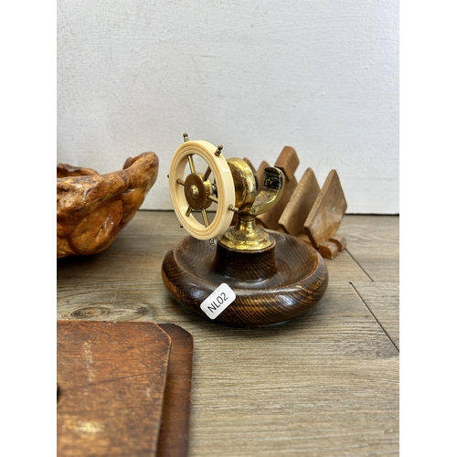 470 - A collection of treenware to include mid 20th century beech and brass ship's wheel nutcracker, teak ... 