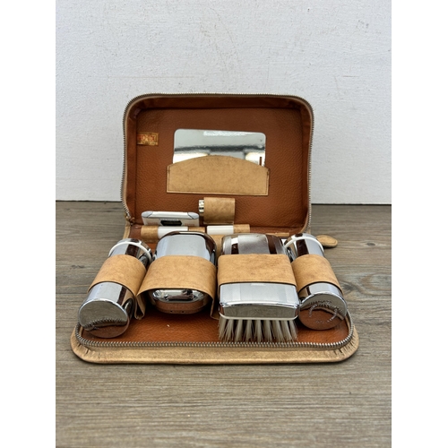 475 - A mid 20th century Two-Tix chromium plated travel vanity set with leather case