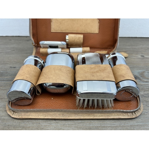 475 - A mid 20th century Two-Tix chromium plated travel vanity set with leather case