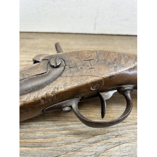 476 - A mid 19th century percussion pistol - approx. 34cm long