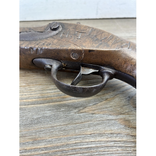 476 - A mid 19th century percussion pistol - approx. 34cm long