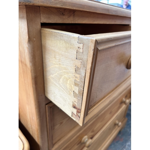 10 - A pine chest of two short over three long drawers - approx. 109cm high x 103cm wide x 47cm deep