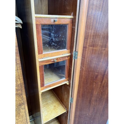 105 - An Art Deco burr walnut three piece bedroom suite