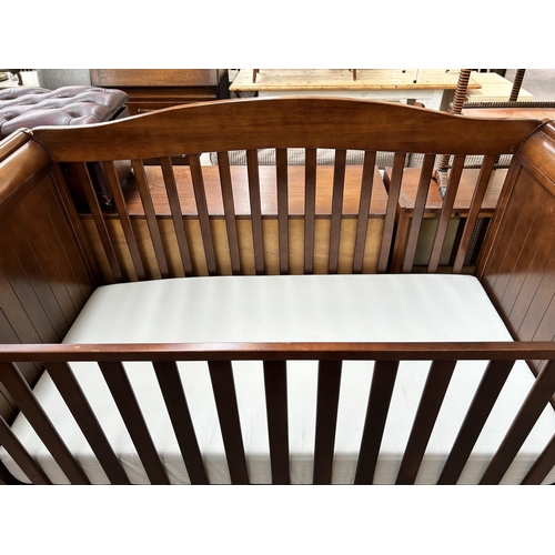 109 - A mahogany sleigh cot bed with mattress - approx. 84cm high x 76cm wide x 160cm long