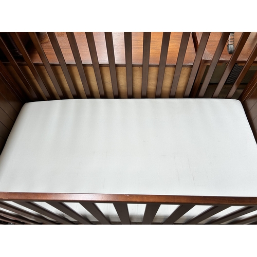 109 - A mahogany sleigh cot bed with mattress - approx. 84cm high x 76cm wide x 160cm long