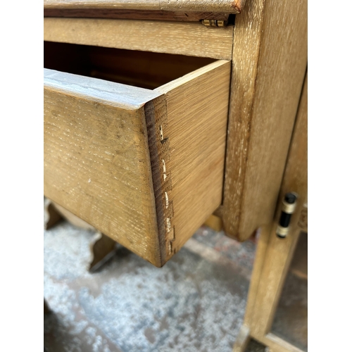 117 - An early/mid 20th century oak side by side bureau bookcase and stool