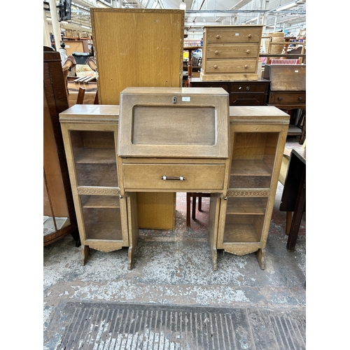 117 - An early/mid 20th century oak side by side bureau bookcase and stool