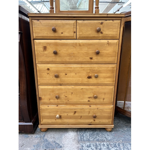 119 - A pine chest of two short over four long drawers and dressing table mirror