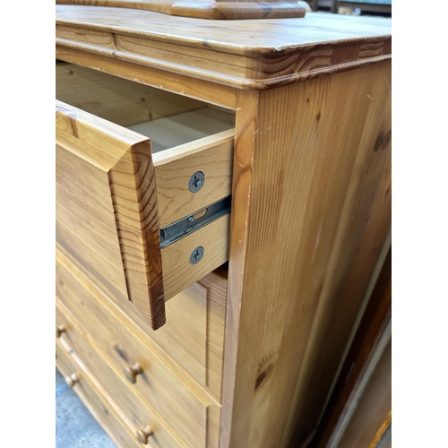 119 - A pine chest of two short over four long drawers and dressing table mirror