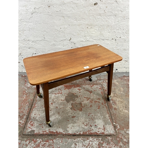 122 - A 1960s Danish rectangular teak coffee table on castors