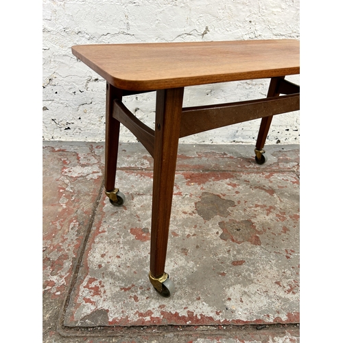 122 - A 1960s Danish rectangular teak coffee table on castors