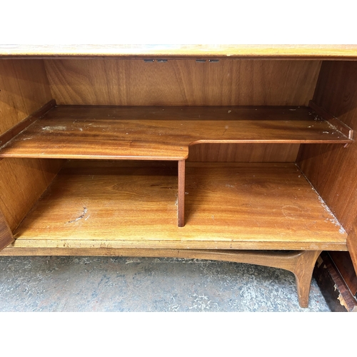 124 - A mid 20th century Alfred Cox walnut sideboard with four drawers and two cupboard doors - approx. 80... 