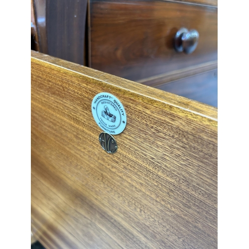 124 - A mid 20th century Alfred Cox walnut sideboard with four drawers and two cupboard doors - approx. 80... 