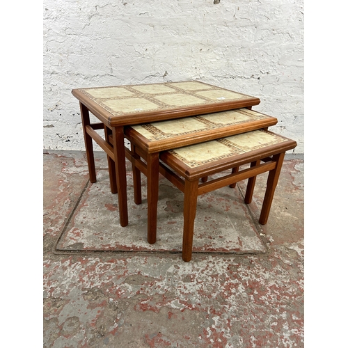 132 - A mid 20th century Danish style teak and tiled top nest of three tables