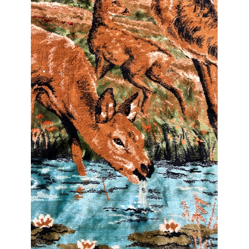 134 - A mid 20th century tapestry wall hanging with deer design - approx. 120cm high x 175cm wide