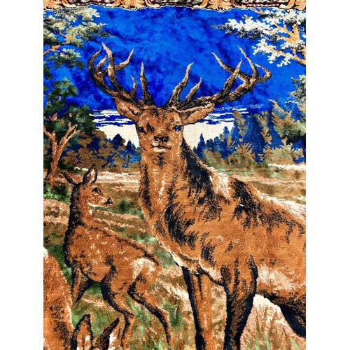 134 - A mid 20th century tapestry wall hanging with deer design - approx. 120cm high x 175cm wide