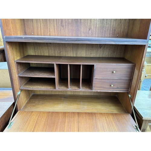 137 - A mid 20th century teak bureau bookcase