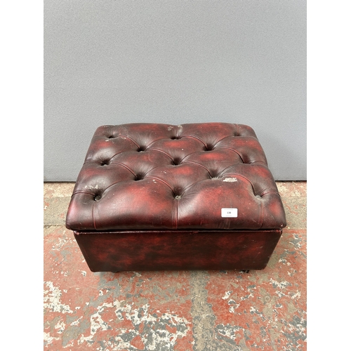 138 - An oxblood leather Chesterfield storage footstool