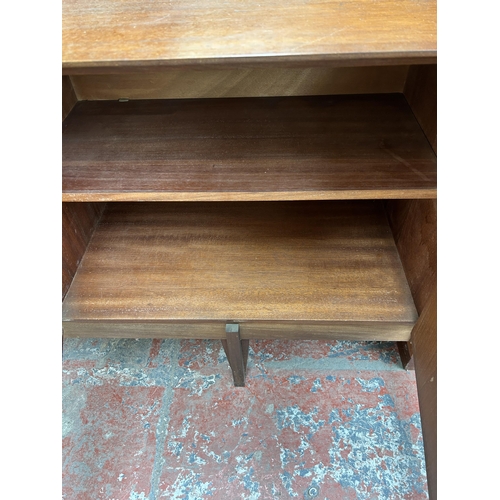 139 - A mid 20th century Stag teak sideboard with three cupboard doors and four central drawers - approx. ... 