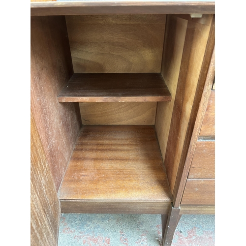 139 - A mid 20th century Stag teak sideboard with three cupboard doors and four central drawers - approx. ... 